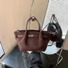 Bolso Cesta Tipo Dumpling de Gamuza para Mujer 2026 Verano Nuevo Ligero para Viajes Cotidianos Casual Versátil Hombro Único Cruzado de Mano