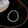 Pulseira de Pérolas Shijia com Fivela Yuanbao para Mulheres, Luxo Acessível, Alta Qualidade, Pulseira Redonda, Elegante Branco Creme Exquisito, Joia de Mão de Nicho