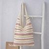 Bolso de hombro cruzado para mujer 2025 primavera y verano nuevo bolso tote de algodón calado de gran capacidad bolso de axila bolso tejido al por mayor