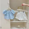 Conjunto Novo Estilo Verão para Meninas 2026 Novo Bebê Estiloso Xadrez Manga Curta Shorts Infantil Conjunto de Duas Peças Estilo Coreano Tendência