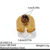 Anillo de acero inoxidable bañado en oro estilo europeo y americano con piedra ojo de tigre, una pieza de joyería lujosa y de alta gama con piedra ojo de tigre natural y acero de titanio, diseñado para ser duradero y resistente a la decoloración
