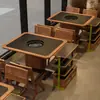 Mesa de hot pot estilo Sanchushan, mesa de barbacoa, mesa y sillas para hot pot y barbacoa con piedra de fuego sin humo, asientos tipo cabina hechos a medida para restaurantes comerciales