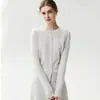 Nuevo cárdigan de punto de cachemira para mujer Otoño/Invierno 2026, cuello redondo, con diseño de flor tejida a crochet en el hombro derecho, prenda exterior de jacquard