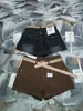 Shorts de Mezclilla Elásticos Color Café Simple Americano para Mujer Nuevos de Cintura Baja Adelgazantes de Corte A Pantalones Cortos Calientes Modernos 8083