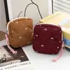 Bolsa de almacenamiento acolchada con forma de lazo para toallas sanitarias, neceser de viaje portátil, bolsa multifuncional para labiales y maquillaje
