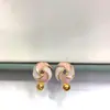 Accesorios y joyería exquisitos al por mayor Pendientes de perlas hechos a mano para DIY con molinete de colores contrastantes rosa y blanco con goteo de aceite