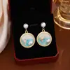 Pendientes de flor de perla de caracola tridimensionales con gotas de aceite de estilo francés, ligeros, de lujo, vintage, de alta gama, naturales y frescos.