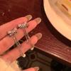 Aretes de borla de circonio de garra de alta calidad con aguja de plata 925 para mujer, temperamento de nicho de lujo ligero, aretes largos, aretes adelgazantes para rostro redondo