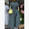 Moda Feminina Transfronteiriça Europeia e Americana Primavera 2026 Novo Vestido Elegante de Meia-Manga com Bolso e Gravata Listrada