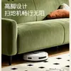 Sofá de tela color crema, de líneas rectas, diseño moderno y minimalista, perfecto para una sala de estar, un sofá cómodo y elegante, una opción popular para apartamentos pequeños