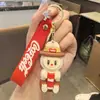 Llavero de Coca-Cola Labubu Transfronterizo Dibujo Animado Muñeca de Oveja Linda Muñeca Colgante para Mochila Regalo de Máquina Expendedora Venta al por Mayor