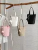 Bolso pequeño de diseño nicho transfronterizo 2026 nuevo modelo bolso tipo cubo para mujer, bolso de hombro único cruzado estilo japonés y coreano para el día a día