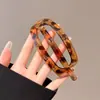 Elegante pinza de garra de abulón mate para mujer, pinza para el pelo de lujo de alta gama, pasador con estampado de leopardo para la parte trasera de la cabeza, elegante accesorio para el pelo de pico de pato