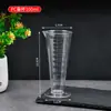 Venta al por mayor de fábrica Taza medidora de plástico Resistente a altas temperaturas Taza medidora cónica Taza graduada Taza medidora engrosada de PP Taza medidora triangular