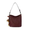 Bolso sencillo de tejido retro para mujer, nuevo bolso cruzado versátil de moda 2026, bolso cubo para hombro o axila para ir al trabajo