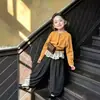 Conjunto de cárdigan de punto súper lindo para niñas Otoño 2026 Nuevo estilo Pantalones de pierna ancha de lunares para niños Ropa para niños