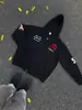 Ropa exterior versátil estilo Hong Kong para primavera/otoño 2026: sudadera con capucha holgada de diseño de letras estampado de moda para hombre