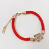 Este año pulsera de cordón rojo cobre rojo calabaza festiva bolsa de dinero oro rosa femenina acero de titanio retención de color regalo de Tanabata