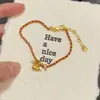 Pulseira Tendência de Corda Vermelha Tecida Estilo Chinês para o Ano do Zodíaco, Apresentando um Design Chinês Tradicional com uma Pequena Cabaça Dourada para Empilhar