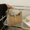 Bolsa de designer nicho estilo coreano para mulheres, novo modelo primavera-verão 2026, bolsa de mão texturizada, bolsa de ombro versátil e elegante