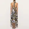Comercio exterior transfronterizo verano nuevo conjunto de dos piezas con estampado estilo europeo y americano, cuello halter, falda irregular, estilo vacacional para mujer
