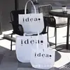Bolsa de mano cuadrada y redonda de tela no tejida engrosada, bolsa universal de luna para tienda de ropa, centro comercial, logo personalizado