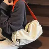 Bolso de hombro liso minimalista estilo japonés, bolso cruzado de nailon unisex, nuevo bolso cuadrado pequeño casual ligero 2026