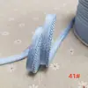 En stock 48 colores poliéster velcro con borde de cordón ribeteado tira de inserción de cuerda para ropa colchas sofás cojines tira de ribete