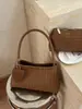 Elegante y versátil bolso tejido 2026 nuevo de verano moderno versión coreana bolso de mano de moda para el trabajo bolso de axila