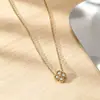 Elegante collar de trébol de cuatro hojas de la suerte incrustado con diamantes, nicho de lujo ligero, moda transfronteriza versátil, collar de acero de titanio que no se decolora para mujer