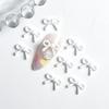 Nuevo estilo pequeño lazo fresco joyería para uñas lindo lazo mini esmerilado accesorios de decoración para uñas al por mayor