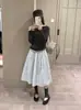 Falda Midi de Lunares Atmosférica Elegante Cintura Alta Lazo en la Cintura Silueta Forma de Botón Falda Otoño Nuevo 2026 Negro