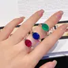 Anillo de Paloma de Huevo de Simulación Sencillo Versátil Esmeralda Incrustado con Diamante de Alto Carbono Anillo de Corindón Rojo Paloma Cristal Azul Puntiagudo para Mujeres