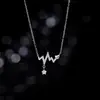 2026 Novo Colar Gargantilha de Prata Pura com Coração e Diamante Incrustado Design de Luxo Leve de Alto Padrão Pingente de Nicho Corrente para Clavícula Feminino