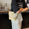 Bolsa Saco Colorida Contrastante Retrô para Mulheres 2026 Nova Moda Versátil Ombro Transversal Grande Capacidade Bolsa de Mão para o Dia a Dia