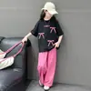 Conjunto de Pantalones Anchos Deportivos Casuales para Niñas Tendencia Nuevo Elegante Moño Niña Pequeña Manga Corta Conjunto de Dos Piezas Verano
