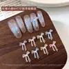 Accesorios de moño para decoración de uñas transparentes tallados suavemente, populares en Xiaohongshu, decoraciones de moño de cinta impresas esmeriladas para uñas