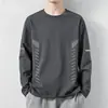 Camiseta casual versátil de manga larga para hombre para otoño, cuello redondo, color liso moderno, cómoda, transpirable y de corte holgado.