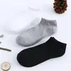 Calcetines Zhuji Primavera y Otoño Color Sólido Blanco y Negro Calcetines Deportivos para Hombres y Mujeres Estudiantes, Transpirables, Absorbentes de Sudor, Resistentes al Olor, Largos y de Longitud Media