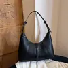 Nuevo estilo de comercio exterior, bolso de un solo hombro moderno y a la moda, bolso de mano simple y casual para mujer, bolso de moda y chic tipo dumpling 2026