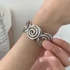 Pulsera Redonda con Apertura Espiral de Textura Metálica Moda Transfronteriza Europea y Americana Pulsera Sencilla Joyería de Lujo Ligero de Alta Gama para Mujeres