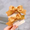 Versão coreana de adereços de cabeça para crianças acessórios de cabelo crianças um par de sinos ensacados laço de tecido presilha lateral pode fazer presilha de topo grampo de cabelo