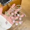 Corrente de Celular com Laço e Pedrarias Estilo Coreano, Design Curto com Strass Brilhantes, Acessório de Corrente de Celular para Pulso