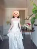Vestido de longitud de pastel estilo resort de playa 2026 Verano Nuevo Estilo Francés Blanco con Volantes de Satén con Tirantes para Mujer