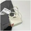 Bolso Cubo de Mano de Nicho Estilo Coreano para Mujer 2026 Primavera Nuevo Moda Bolso de Hombro Único Bolso Cruzado Simple de Alto Valor