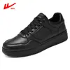 Zapatos casuales planos transpirables versátiles para hombre otoño primavera y otoño estudiantes de secundaria superficie de cuero deportivo Zapatos de moda blancos impermeables