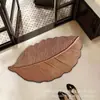 Alfombra absorbente antideslizante para baño del hogar, alfombra absorbente con drenaje de agua para encimera de cocina, alfombrilla de suelo simple de tierra de diatomeas con forma de hoja
