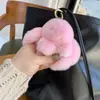 Al por mayor colgante de conejo de peluche de pelo de conejo rex real, conejo de peluche falso, llavero de coche, linda decoración de bolsa, pequeño accesorio de conejo para bolsa