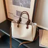 Bolso de mano elegante y versátil para mujer, nuevo diseño moderno 2026, adecuado para ir al trabajo, se puede llevar en la mano o usar como bolso de hombro o bolso cruzado