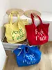 Bolsa Coreana de Nailon Dopamina Doble Cara Estilo Perezoso Rayas de Colores Estampado de Letras Simple Bolsa para Estudiantes y Viajeros